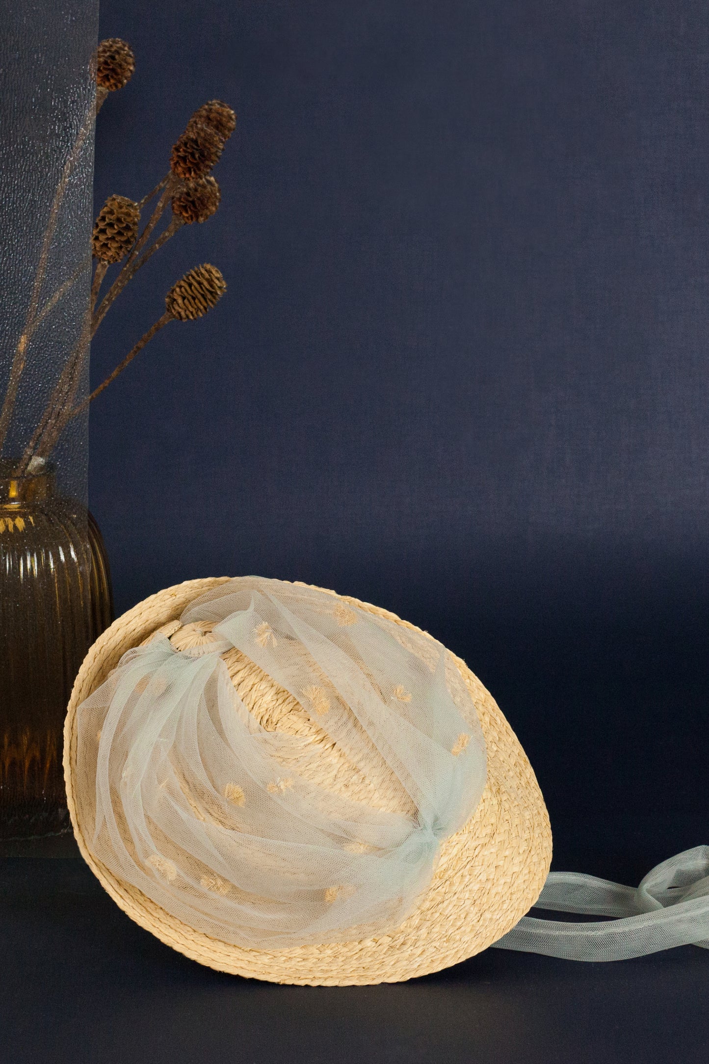 Bianca raffia fascinator with nylon mesh on the crown