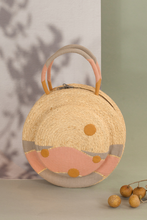 Load image into Gallery viewer, Clementine is round in shape. The two sides of the bag are decorated, incorporating details to emphasize a fun garden