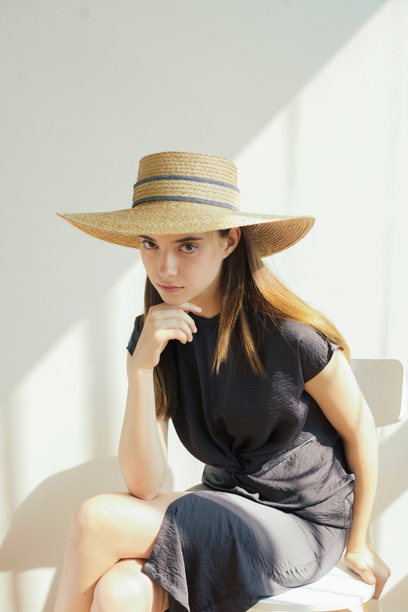 Model wearing Merlier Coast Classic raffia straw wide brim hat
